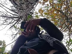 Muscular guy bodybuilder is jerking off in forest outdoor