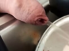 Close up peeing on dishes