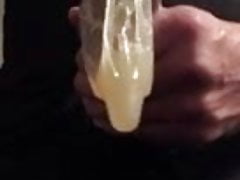 Jerking with a friends used condom on my cock