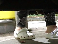 My girlfriend pumping gas in her white crocs