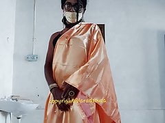 Indian crossdresser model Lara D'Souza in orange satin saree