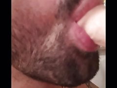 Big guy fingering himself and sucking a dildo in the shower
