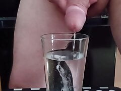 Cumming in a glass of hot water