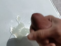 Cumming on glass table