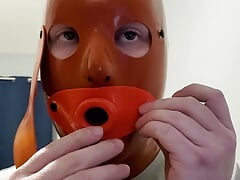 Sissy with Latex Hood Swallows Cum from Condom