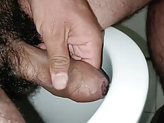 How am I caressing the hair in the toilet?