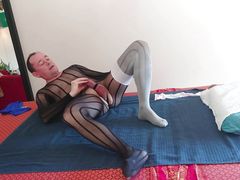 crossdresser plays with her stiff cock in naughty nylon lingerie