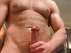 MUSCLE STUD PLAYS WITH HIS MASSIVE COCK