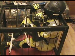 Caged bikerslave is restrained