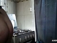 Sexy man at the kitchen cooking nude.