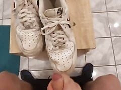 Young teen jerking off on his leather shoes while standing