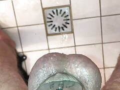 Shower pissing in micro chastity cage with penis plug POV