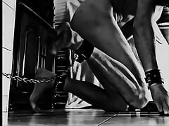 A real BDSM slave cleans the floor chained by the buttocks under the orders of his cruel Mistress. video of Slave-K001