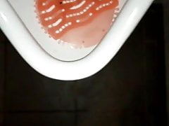 Peeing in urinal