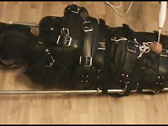 Restrained slave in the insane sack.