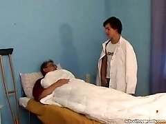 Cute Daddy with young buy in hospital bed