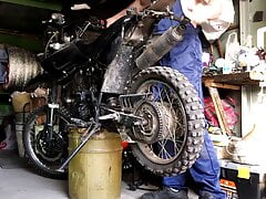 A Russian MECHANIC repairs a MOTORCYCLE in the garage and gets excited and FUCKS a silicone ass