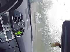 Horny in the car during a rainy day