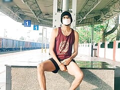 Tall sexy gay boy having fun with dick at railway station