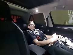 Young teen fucks with his shoes in the car and has fun