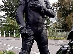 blows on balls and cock in full leather suit