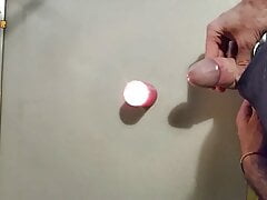 Homemade handjob and big load on a candle. Jerking off in a homemade amateur video, big cock and big load.
