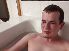 Mild watersport in the bath pt 2 - guy talks to the camera before peeing on himself in the bath tub