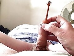 Short video, long foreskin - rubber toy