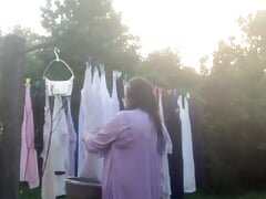 Collecting the bottoms of dresses in nightie and undressed
