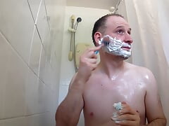 Man in shower washing than shaving his body, balls, armpits, legs and anus