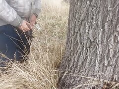 Pissed under a tree. Lots of piss from big cock
