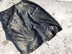 crushing wet soil on black skirt & washing