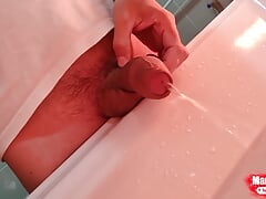 Fat uncut cock pissing in the washbasin