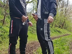 Two hot, horny boys smoking and wanking their dicks outdoors