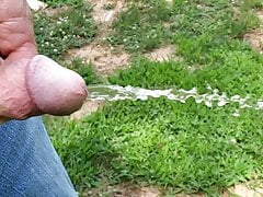 Small dick pissing in super slow motion outside