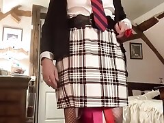In a secretary outfit with a white plaid skirt